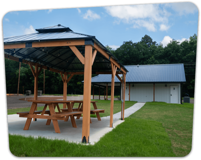 covered picnic area in front of bathrooms
